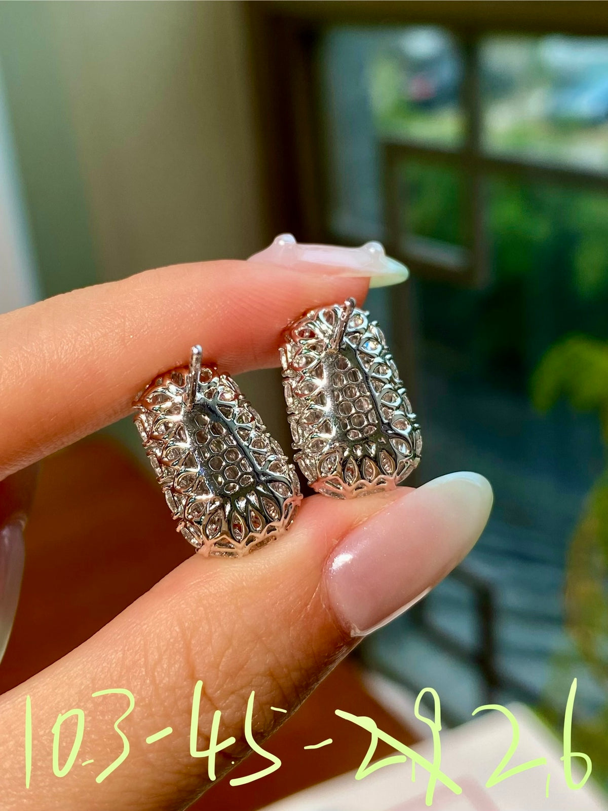 Green jadeite tablet stud earrings with halo of clear stones, ornate silver-tone setting