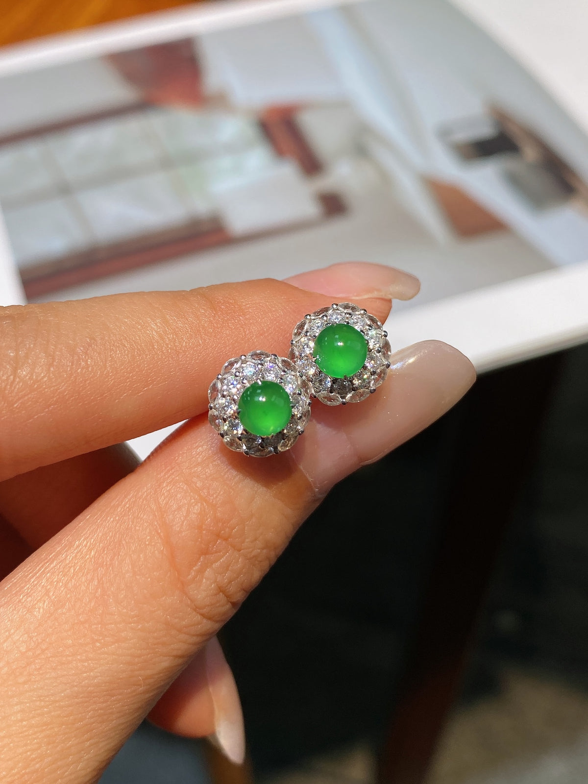 Jadeite cabochon stud earrings, two green round cabochons with clear stone halo