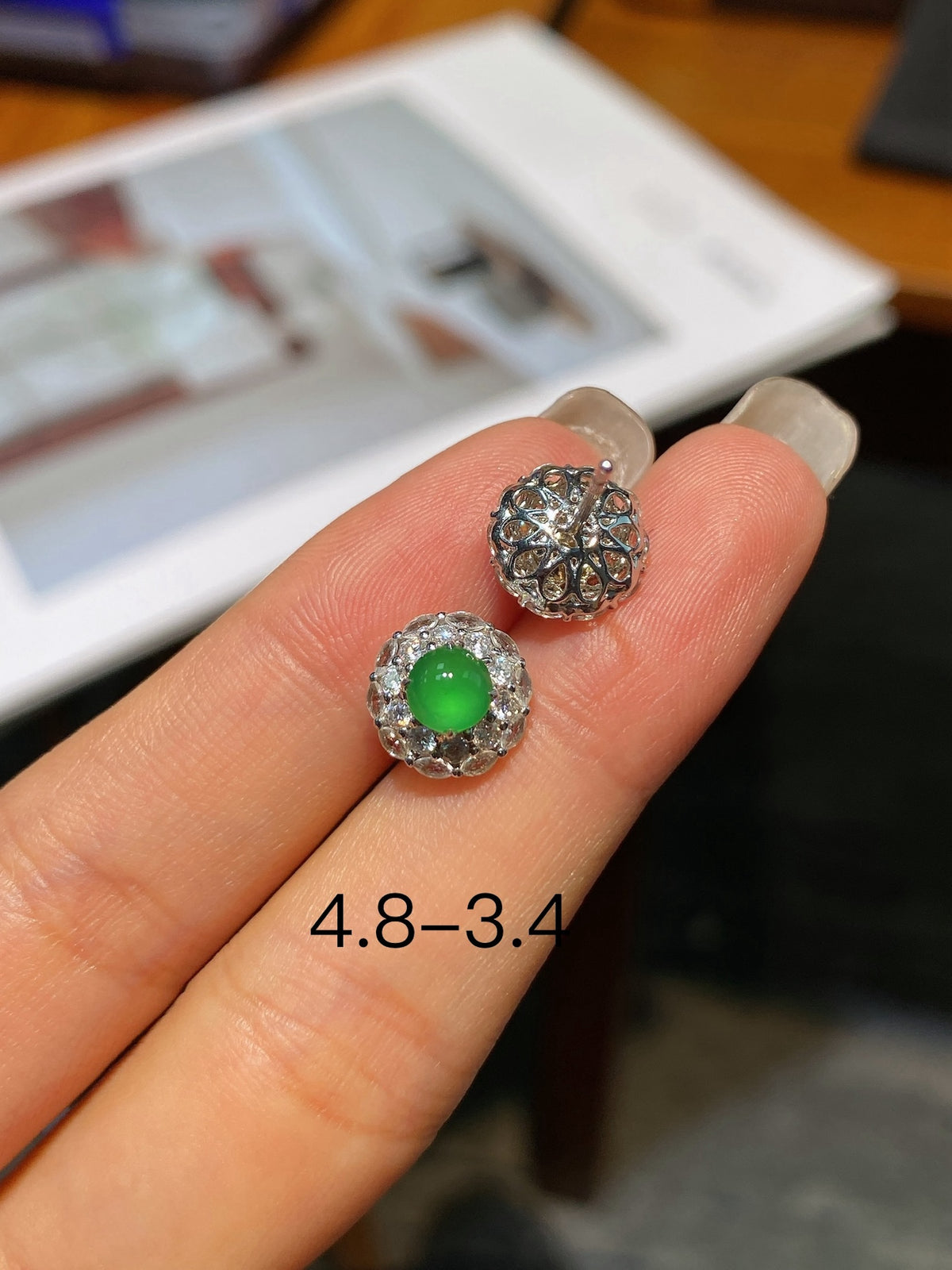 Jadeite cabochon stud earrings with green round center and sparkling halo settings