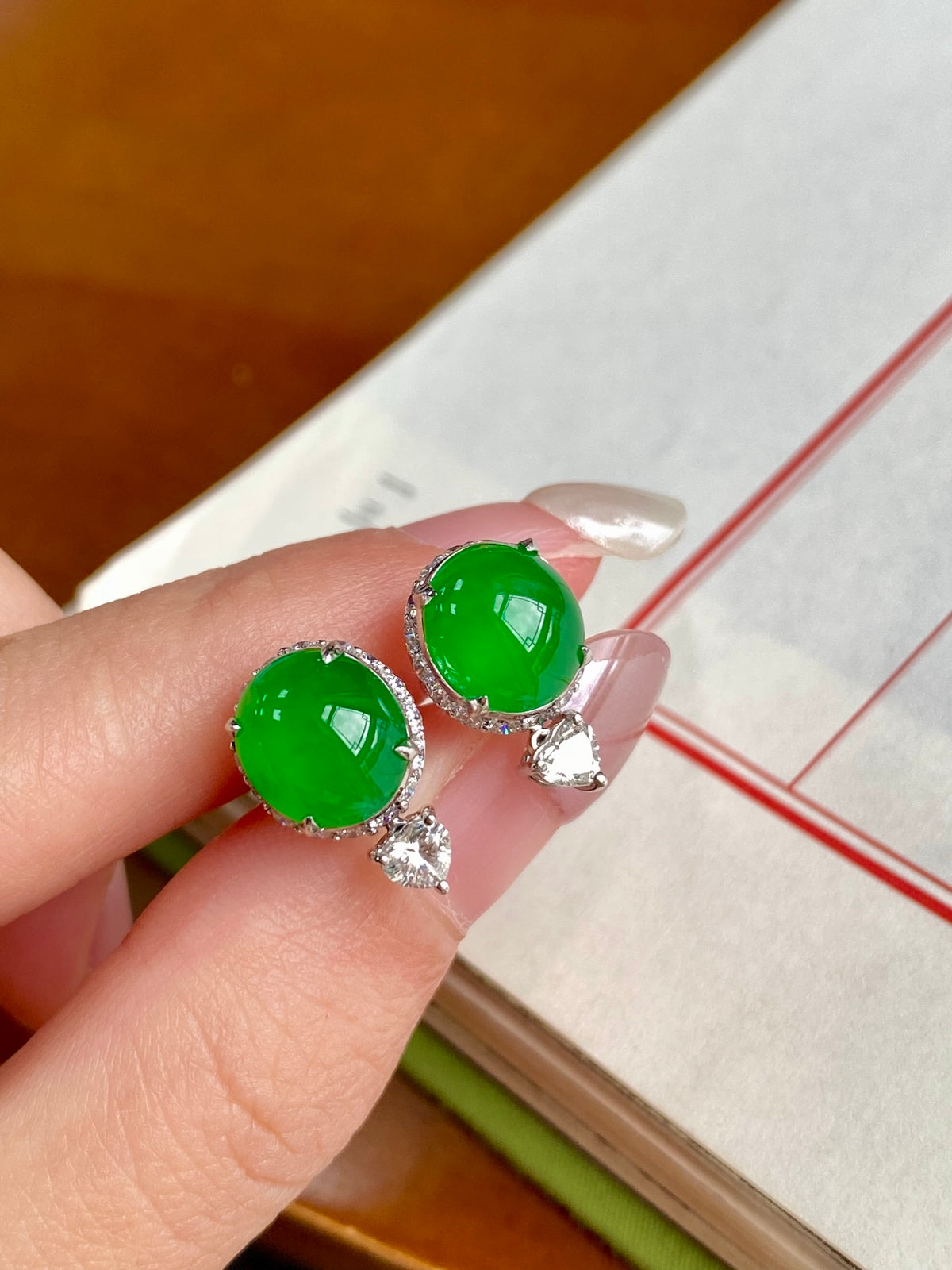 Green jade cabochon stud earrings with teardrop crystal drops in silver-tone frames
