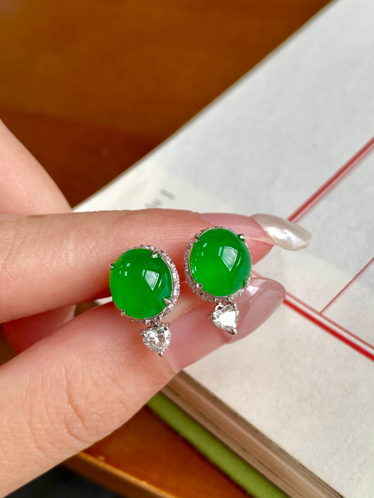Green cabochon stud earrings with bezel halo and dangling small crystal charm pieces