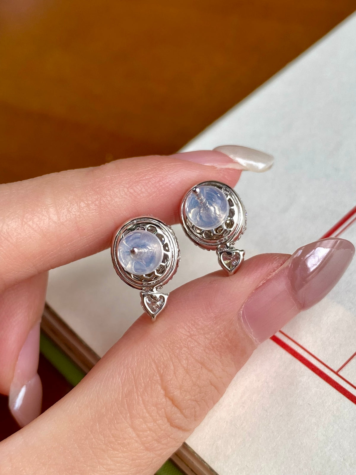 Light blue jade cabochon stud earrings with halo bezel and dangling crystal drops