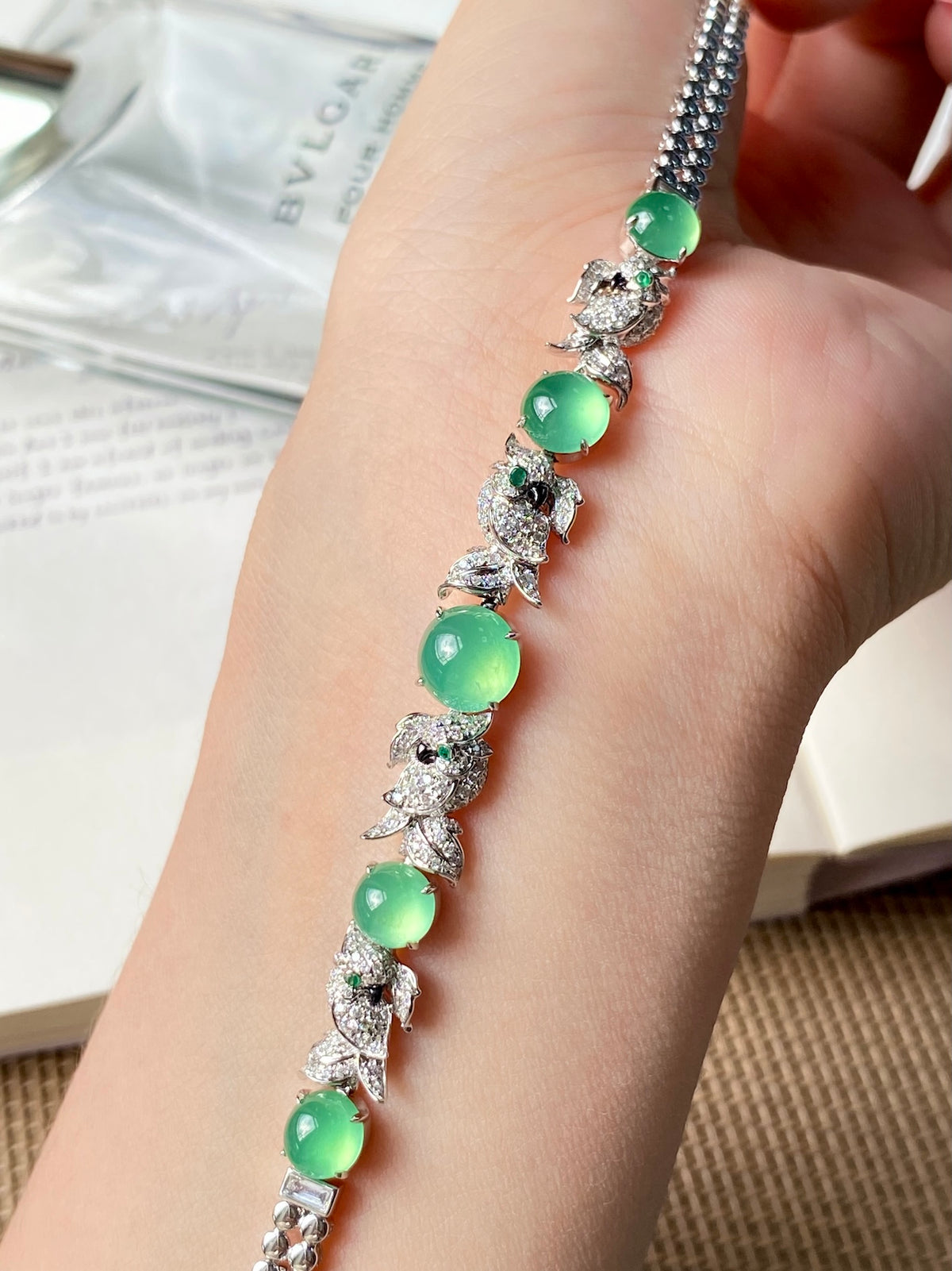 Jadeite cabochon bracelet with green oval cabochons and clustered diamond-style centers
