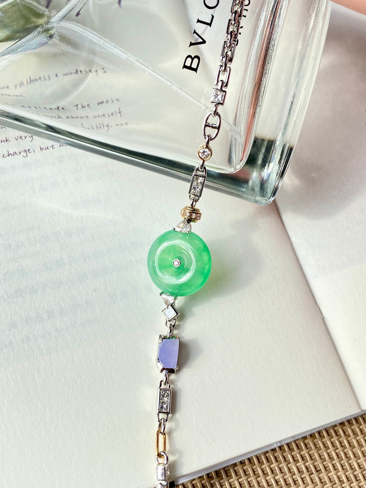 Green jade donut bracelet with rectangular crystal links and small purple bead