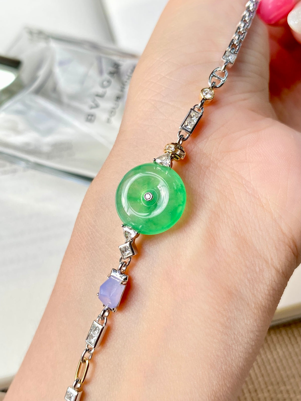Jadeite donut bracelet with round green charm and silver square-link chain
