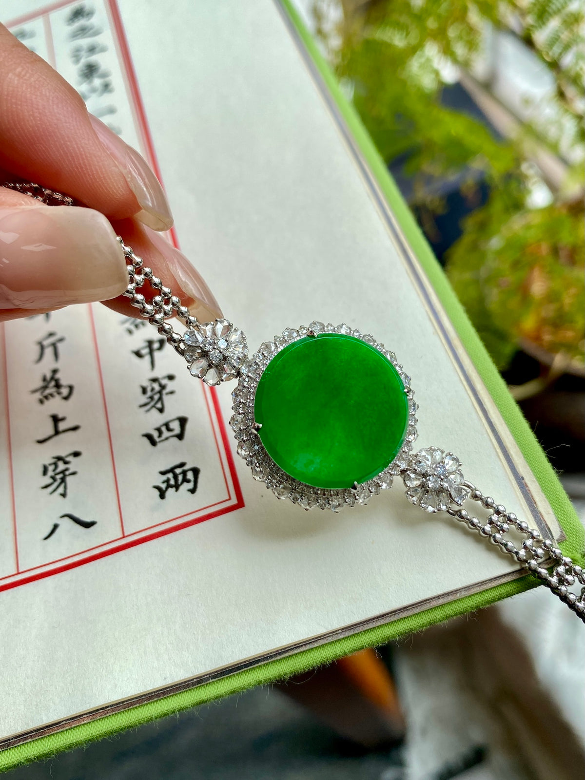 Green jadeite tablet bracelet with silver-tone chain and crystal accents
