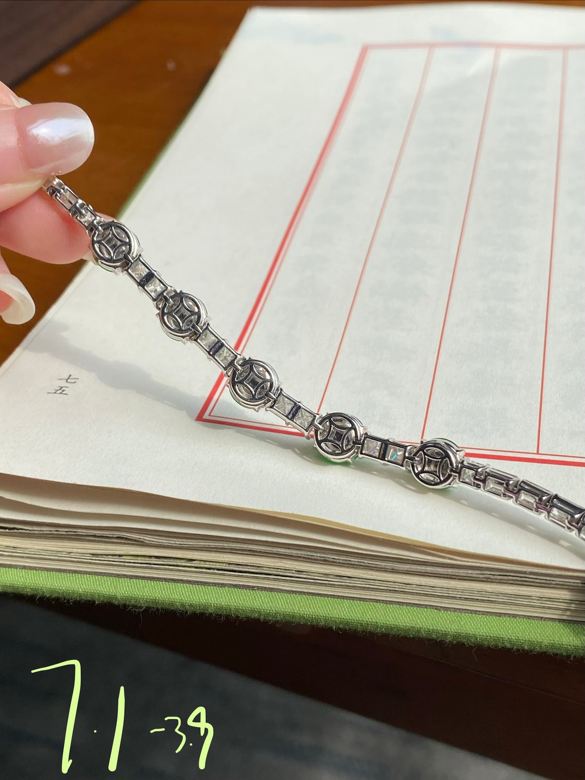 Green jadeite cabochon bracelet side view with ornate silver link segments