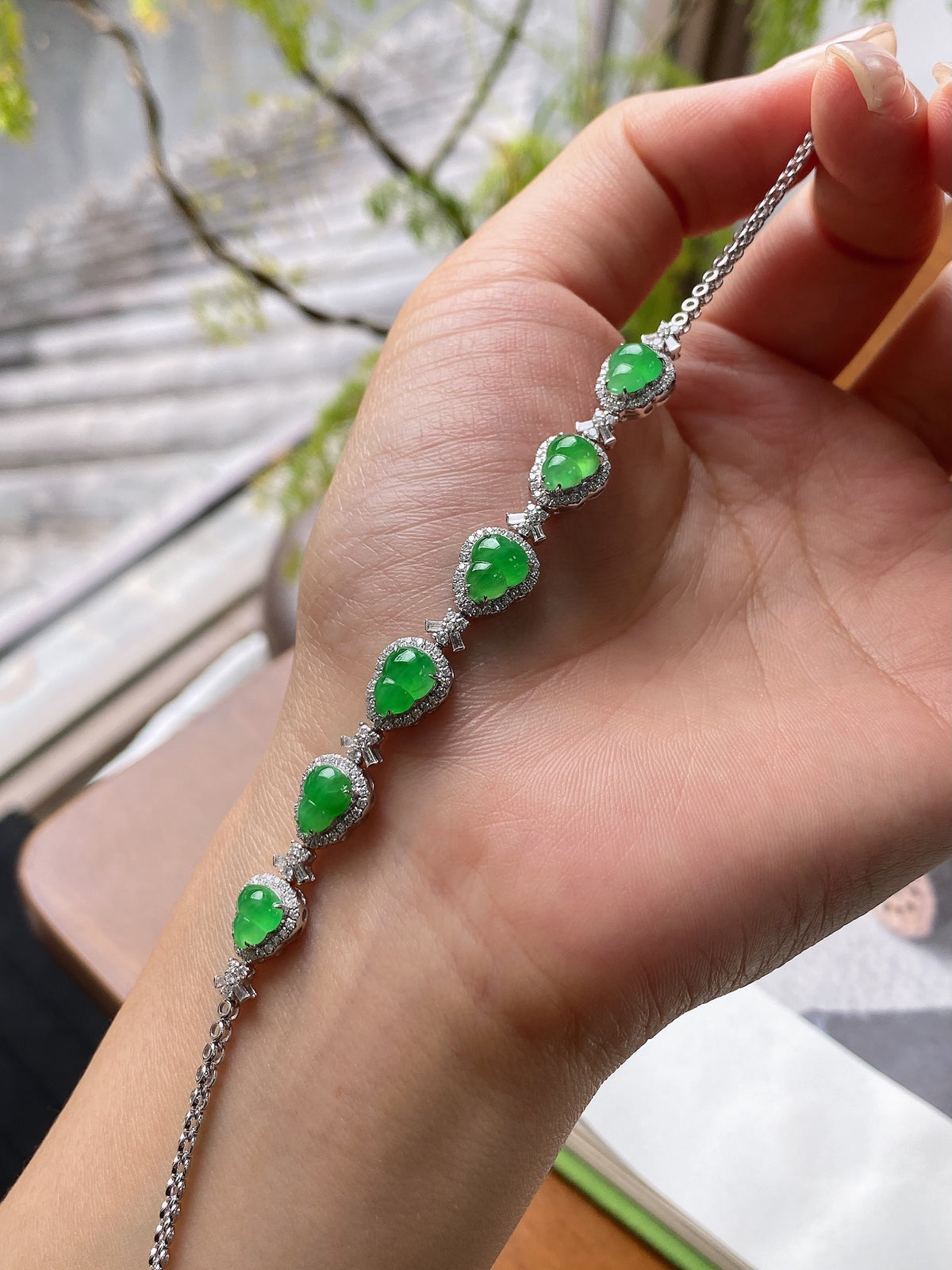 Green gourd jadeite cabochon bracelet with oval stones and silver link chain