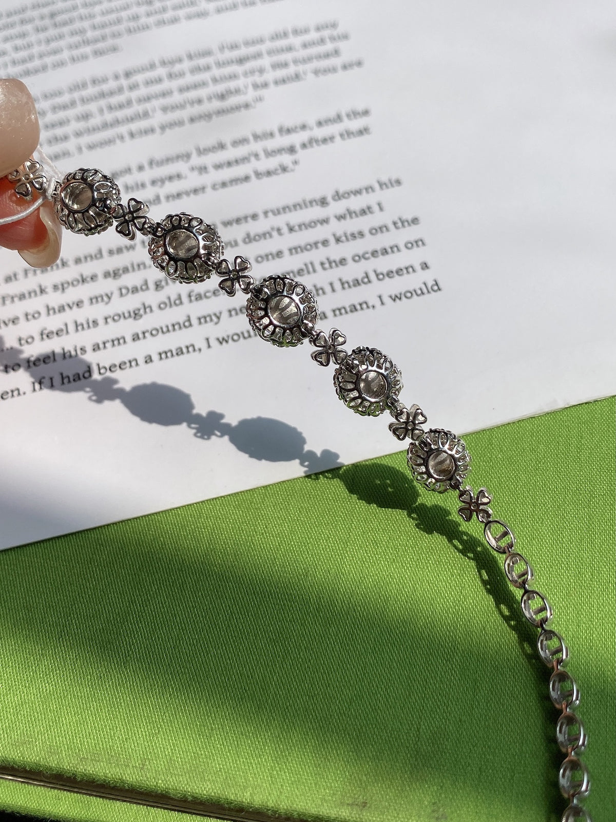 Silver bracelet end links with round filigree settings and chain clasp