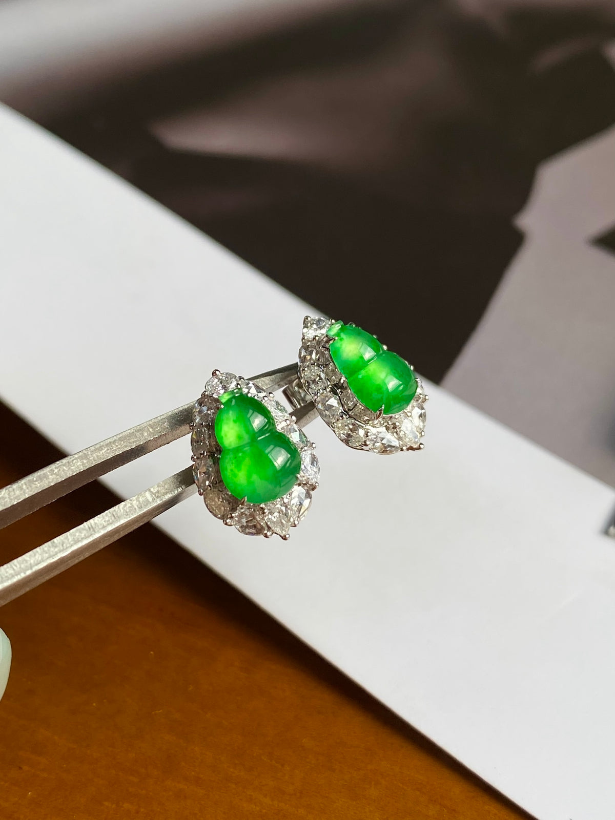 Green jadeite gourd stud earrings with crystal halo, silver-tone setting