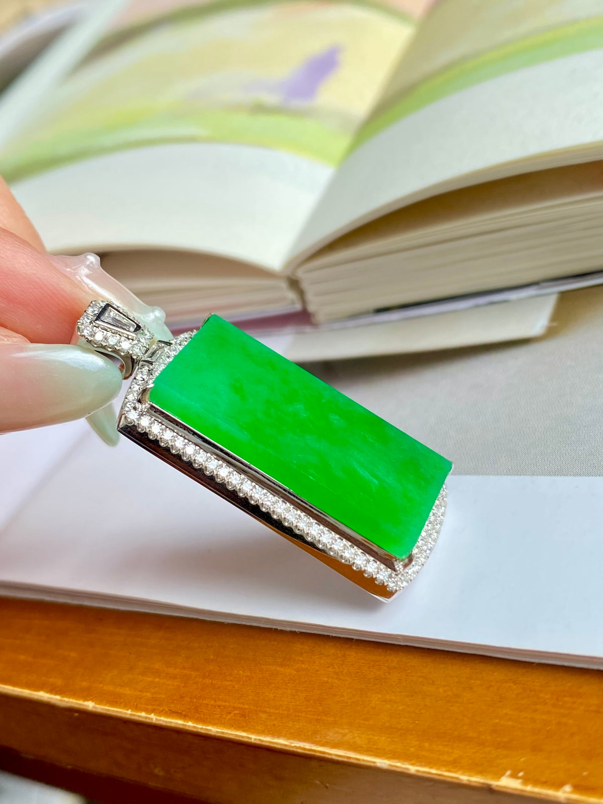 Green jadeite tablet pendant with diamond-like border and silver bezel setting