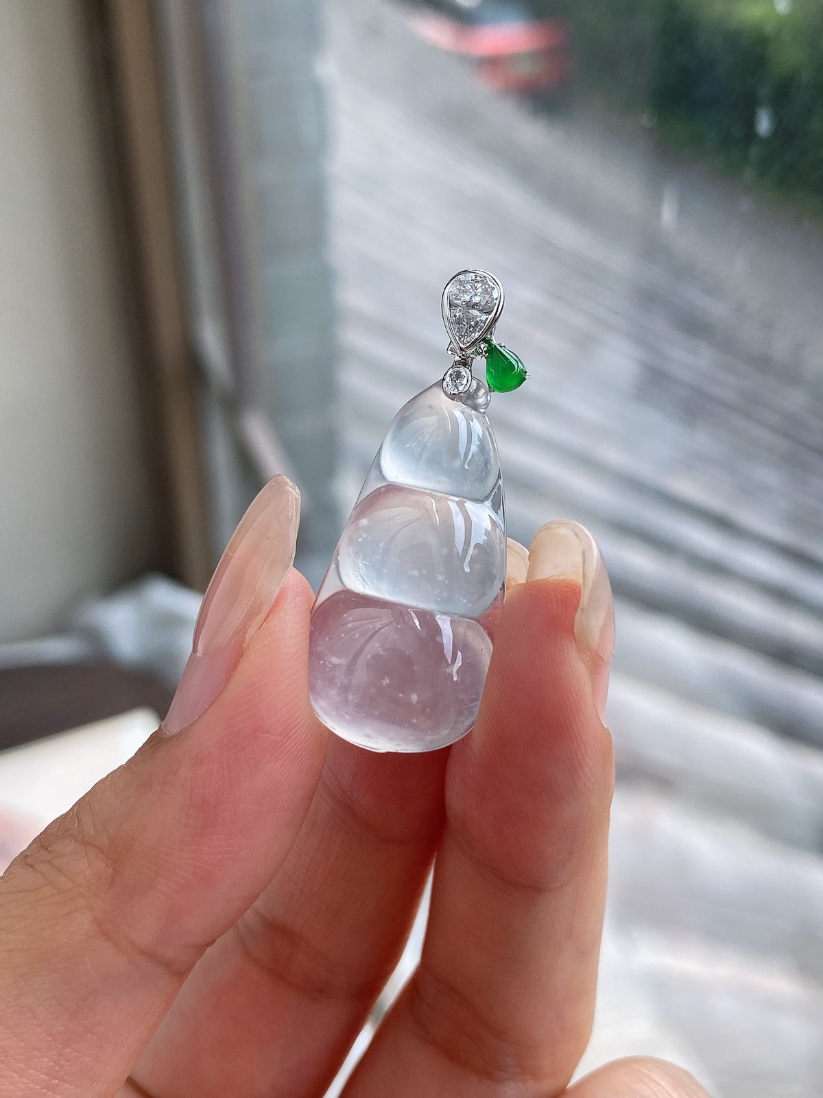 Icy white jadeite pea pod pendant with green accent, silver top cluster