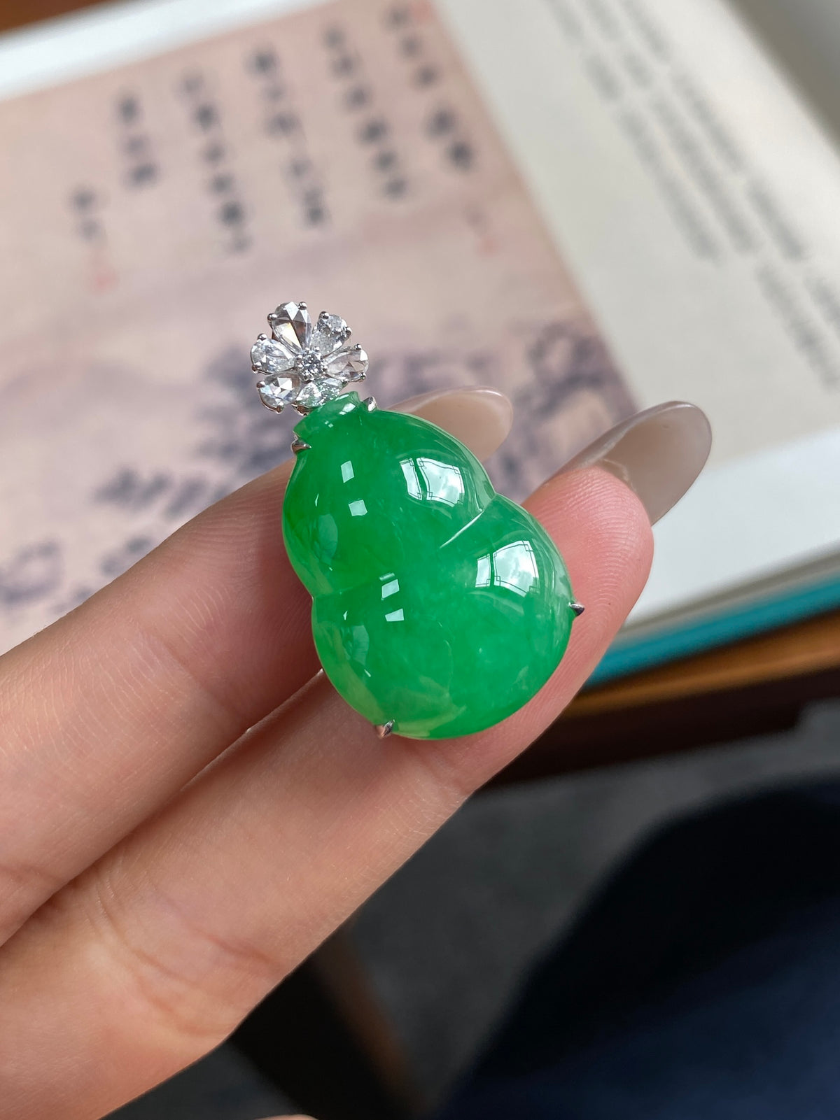 Green gourd jade pendant in silver-tone bezel with round crystal top detail