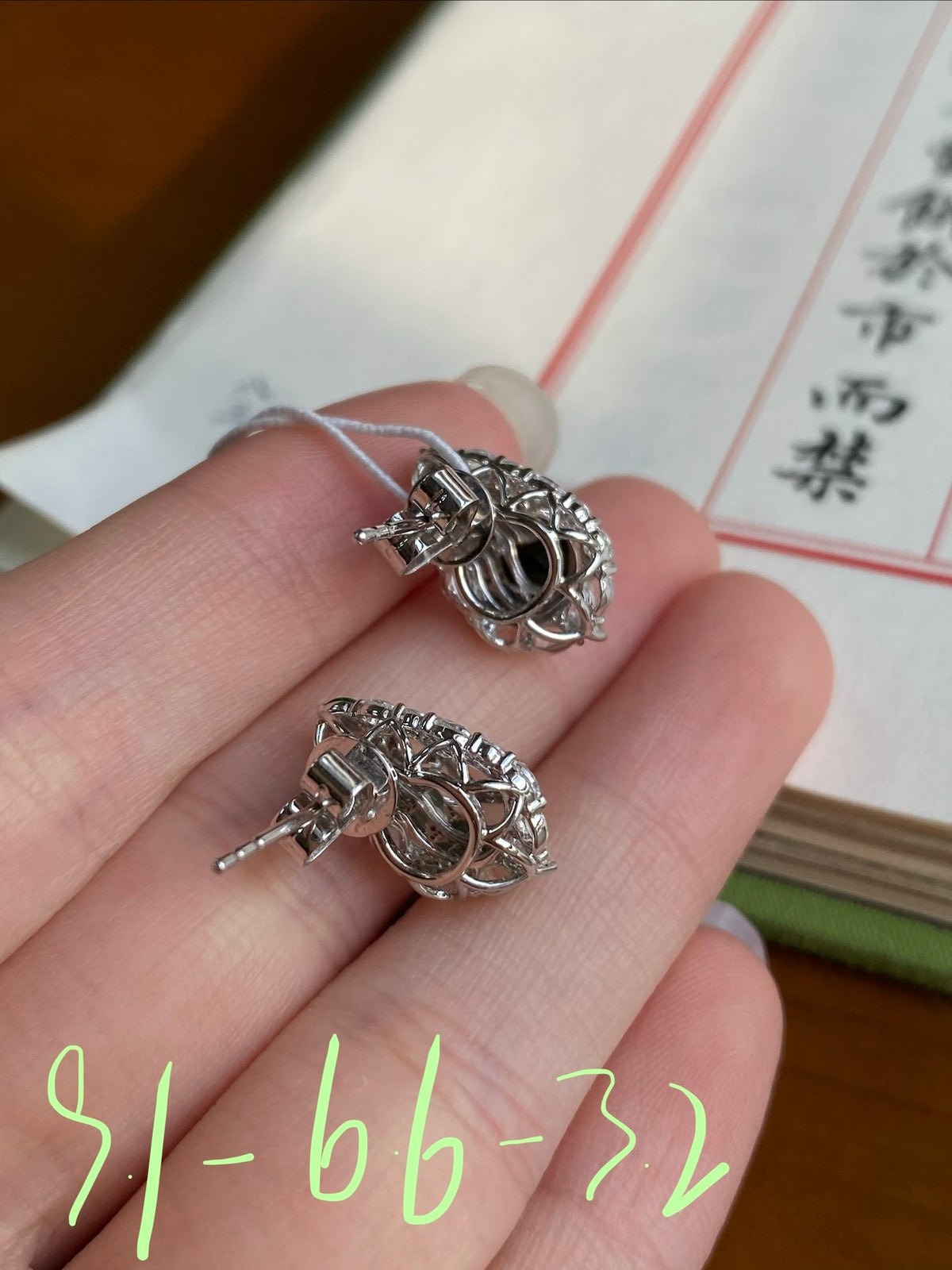Silver-tone oval stud earring backs and posts with ornate halo design