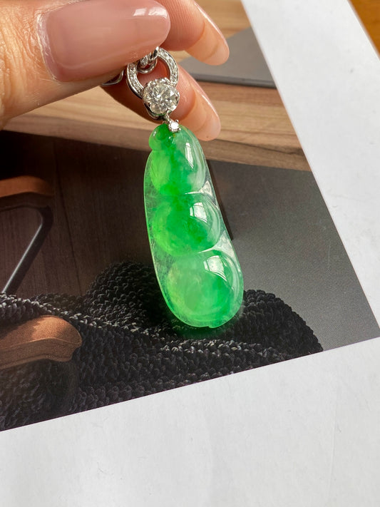 Green jadeite bean pendant on silver-tone textured frame