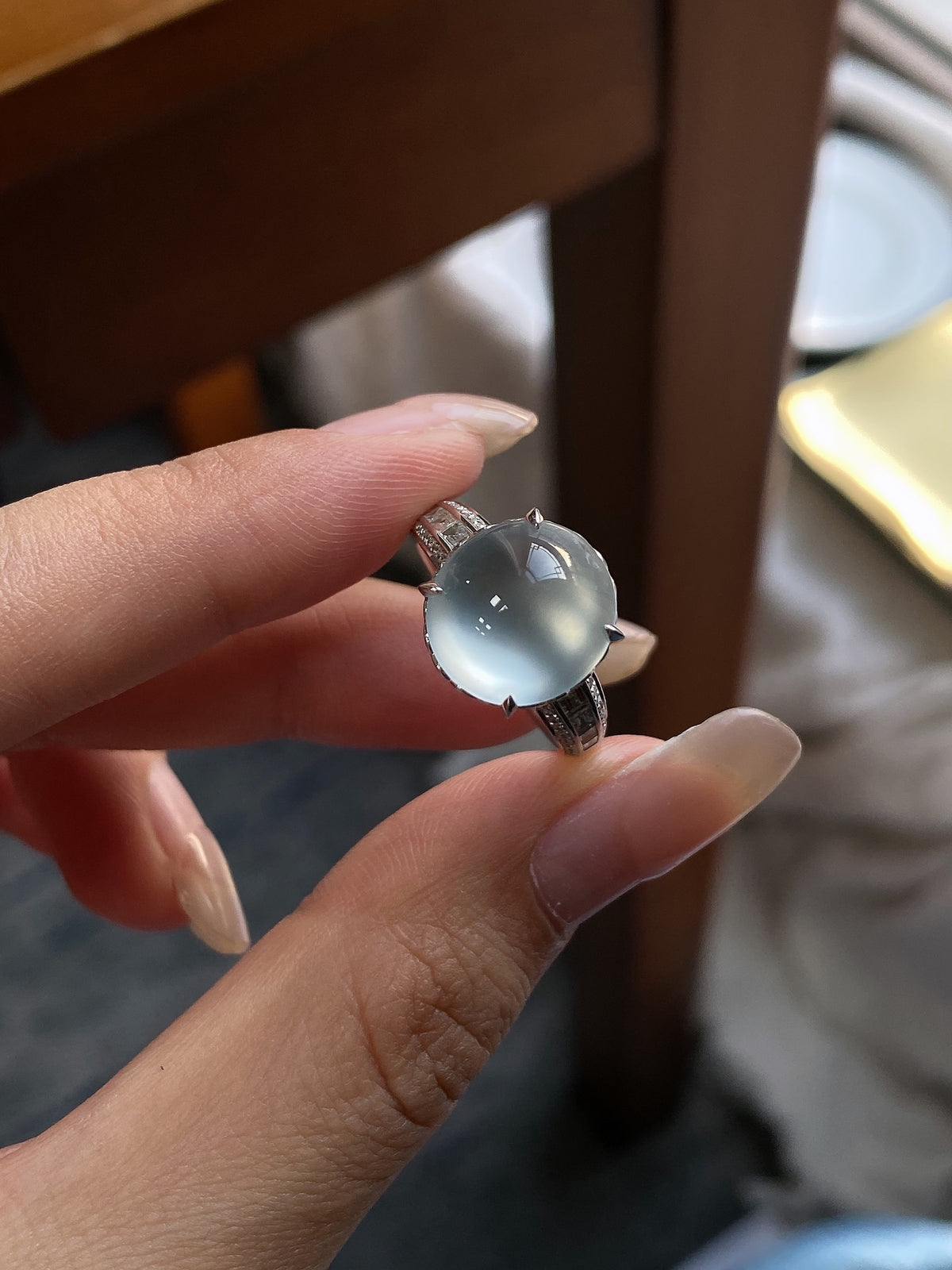 White jadeite cabochon ring, round pale stone, dark textured band