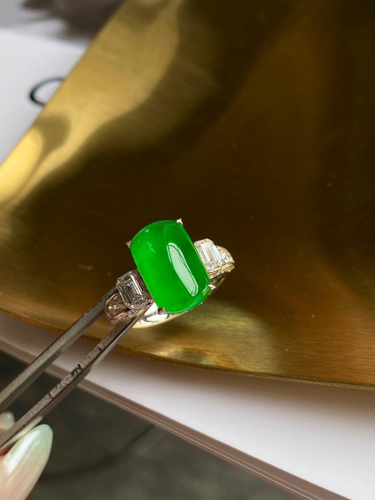Green jadeite tablet ring with baguette diamond accents and silver setting