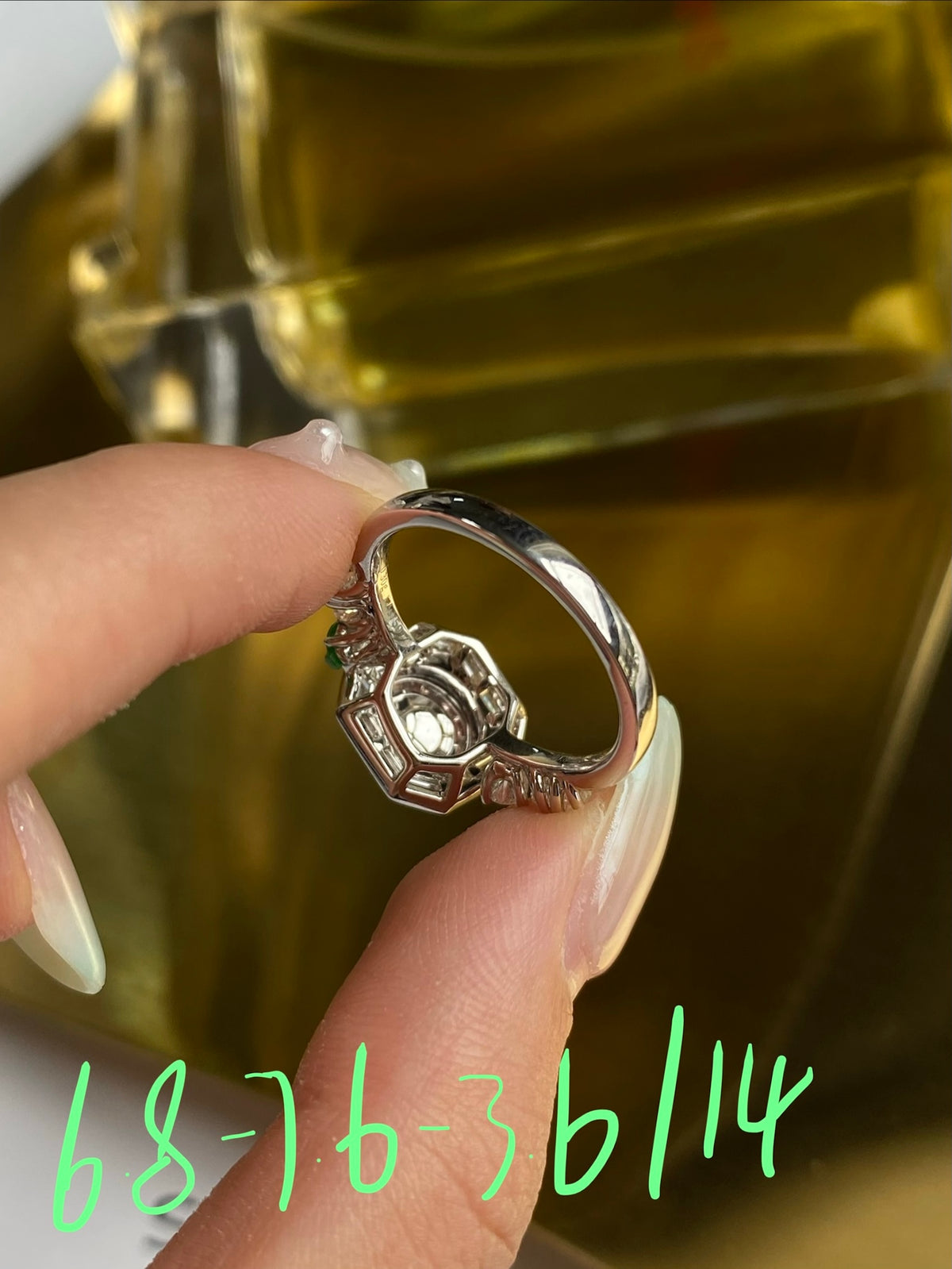 Silver cabochon ring shown from the side, with octagonal setting