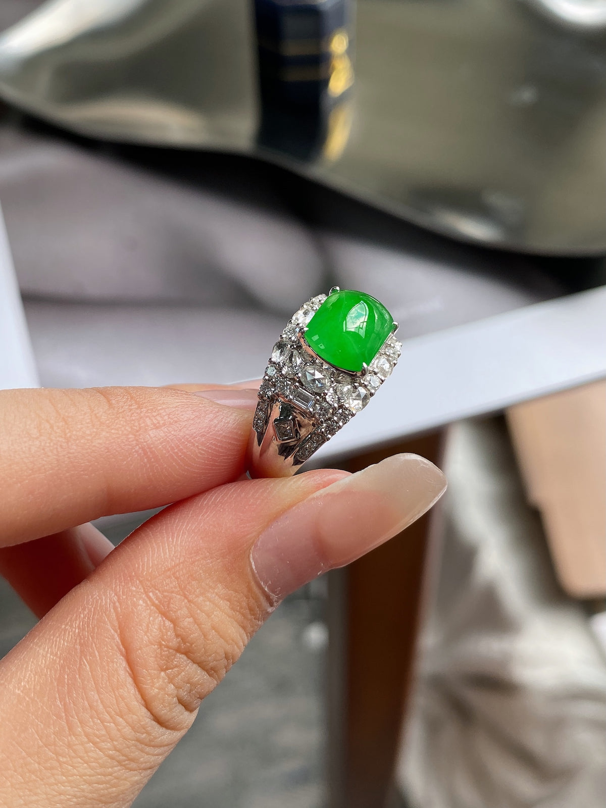 Green jadeite plaque ring with sparkling pave halo, oval gemstone on silver