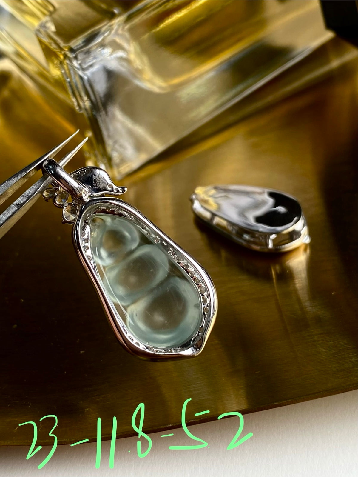 Jadeite bean pendant in silver-tone setting