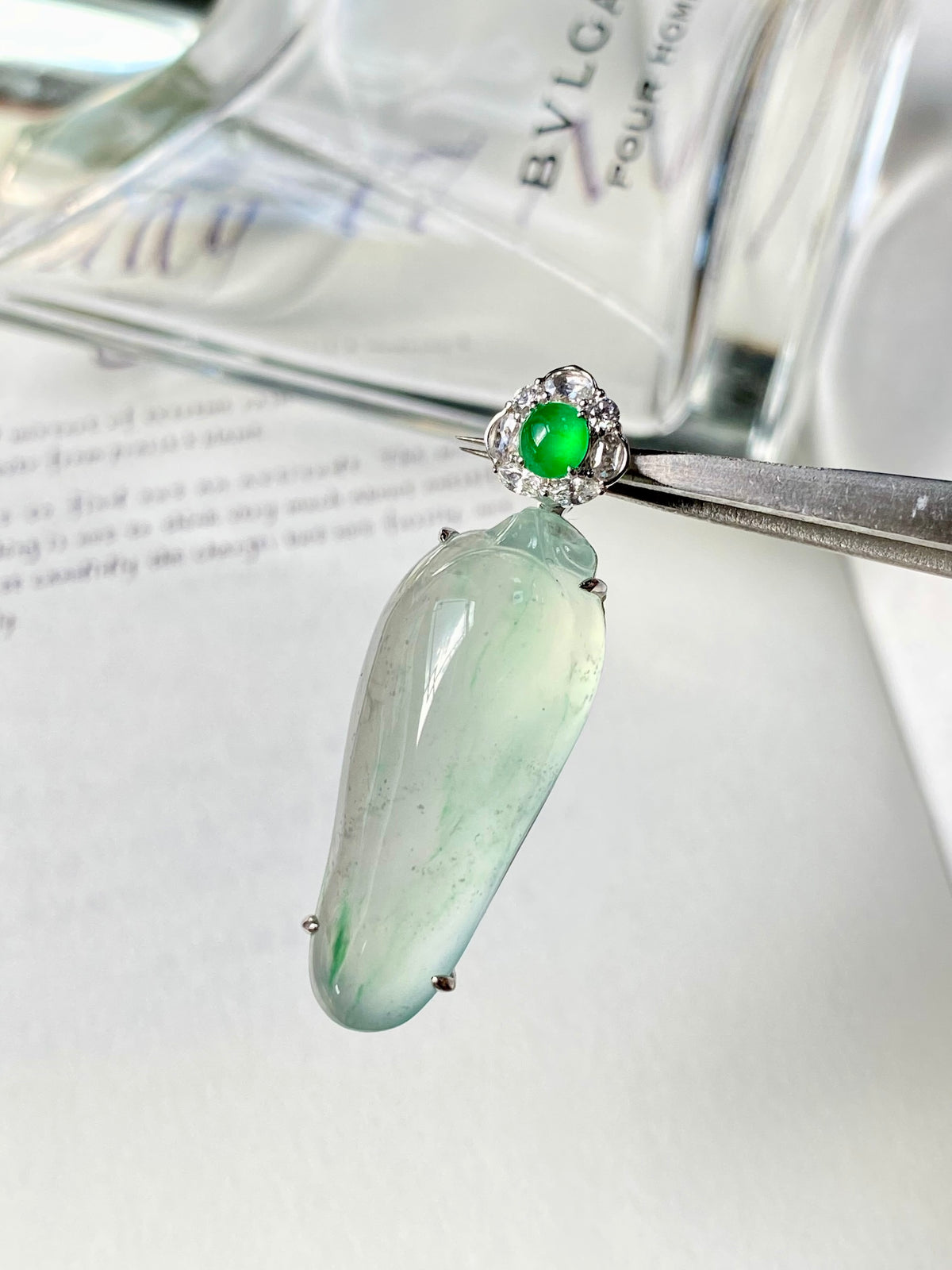 Green jadeite gourd pendant with round green center and crystal halo, silver setting