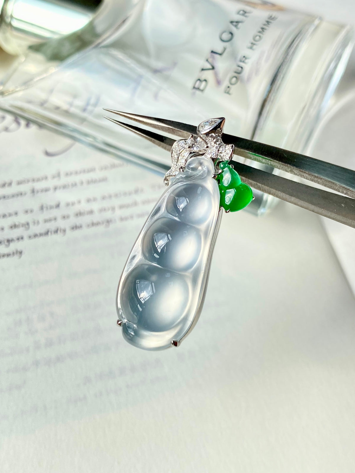 Silver-tone jadeite bean pendant with clear teardrop stone, diamond accents, green detail