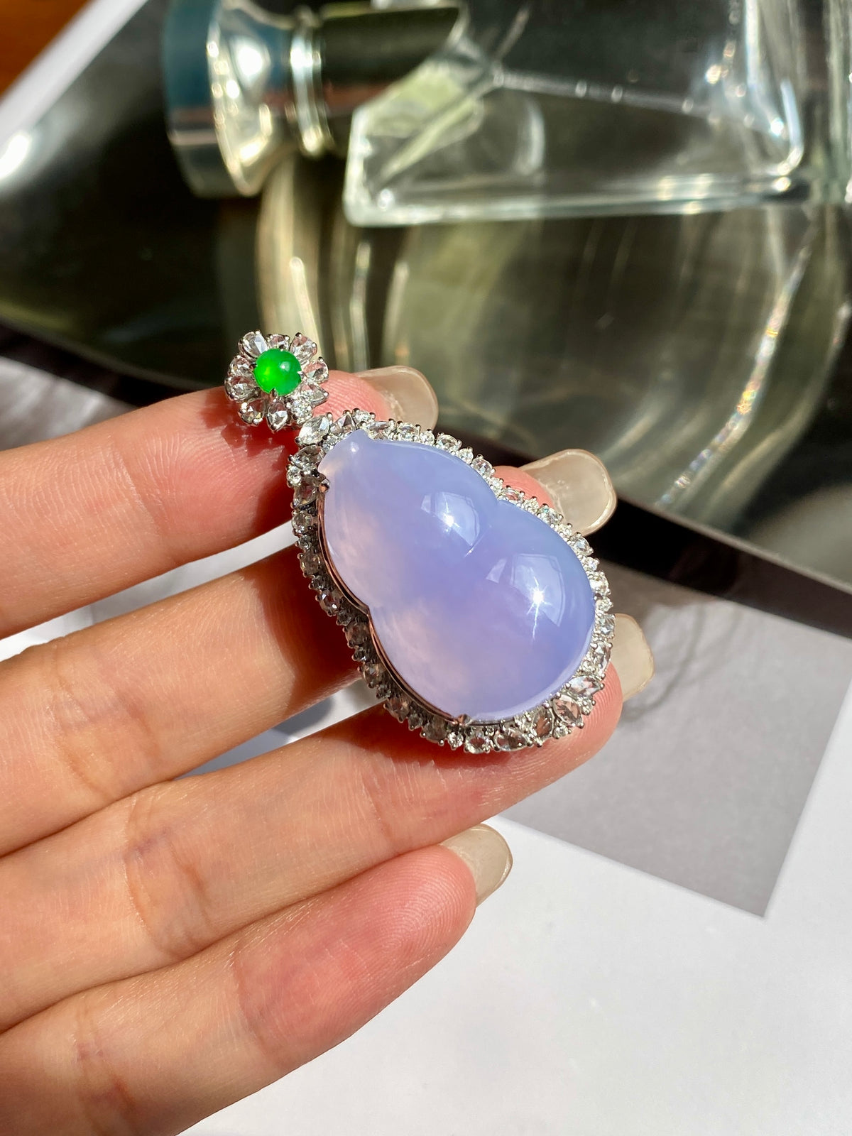 Lavender-purple gourd jadeite pendant with silver-toned rhinestone setting and green accent