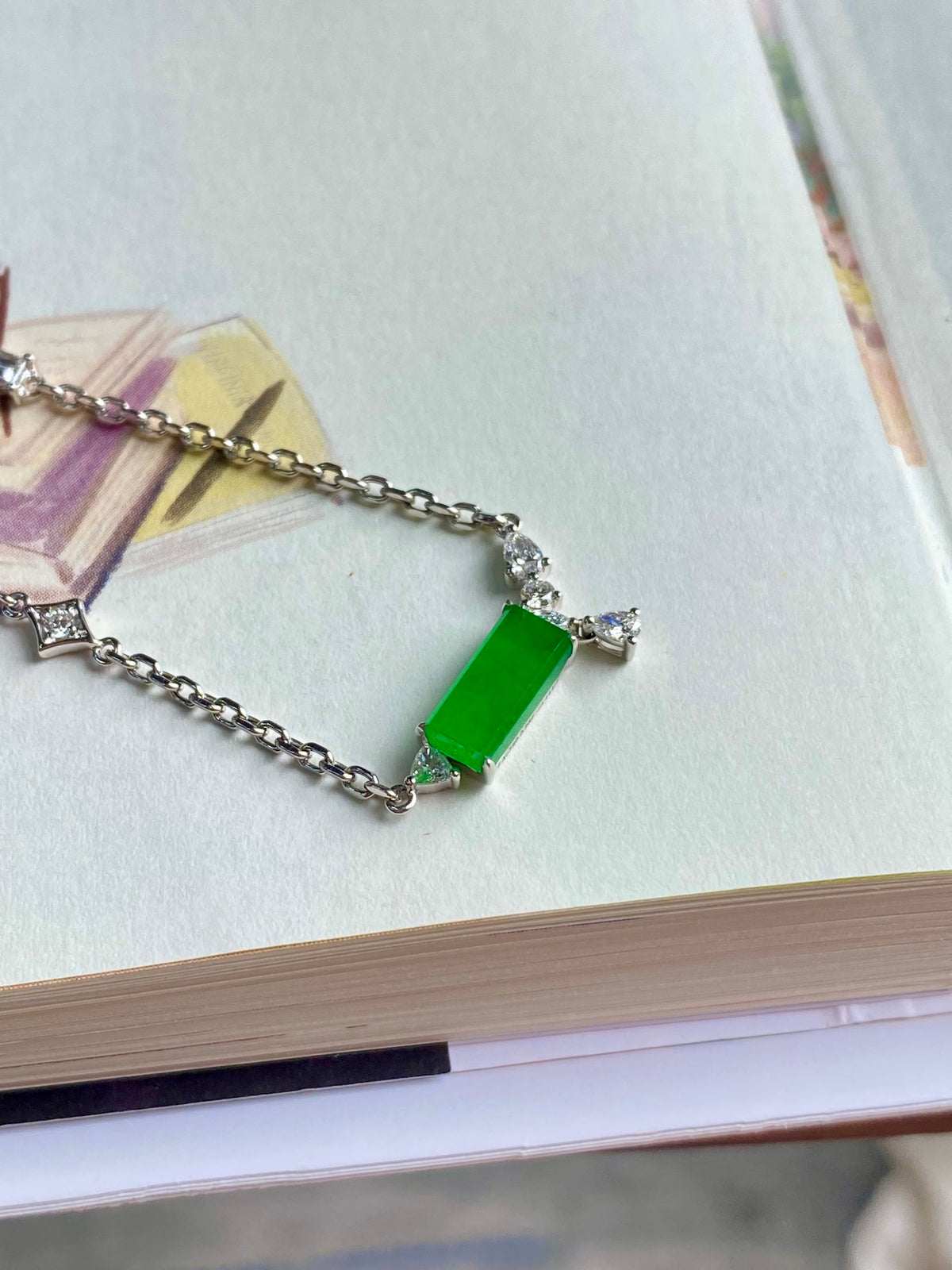 Green jadeite tablet bracelet with silver chain and small clear stone charms