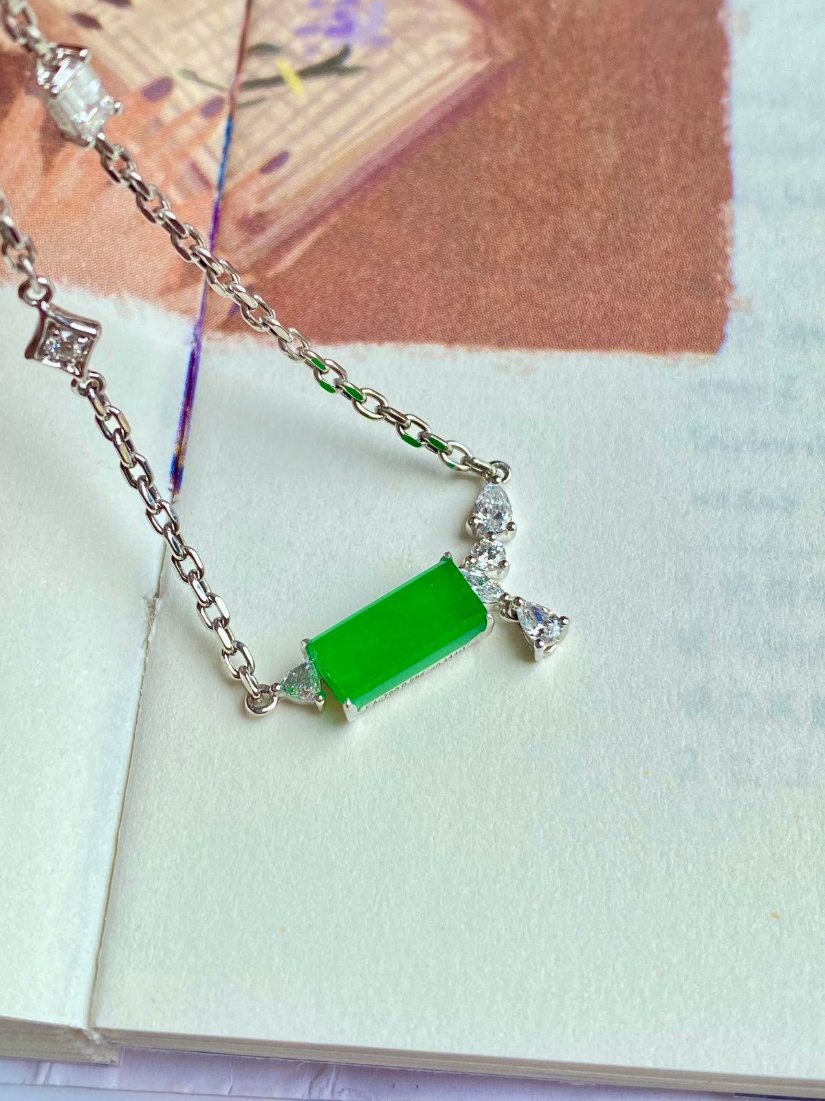 Silver chain jadeite tablet bracelet with clear stone clusters and green center