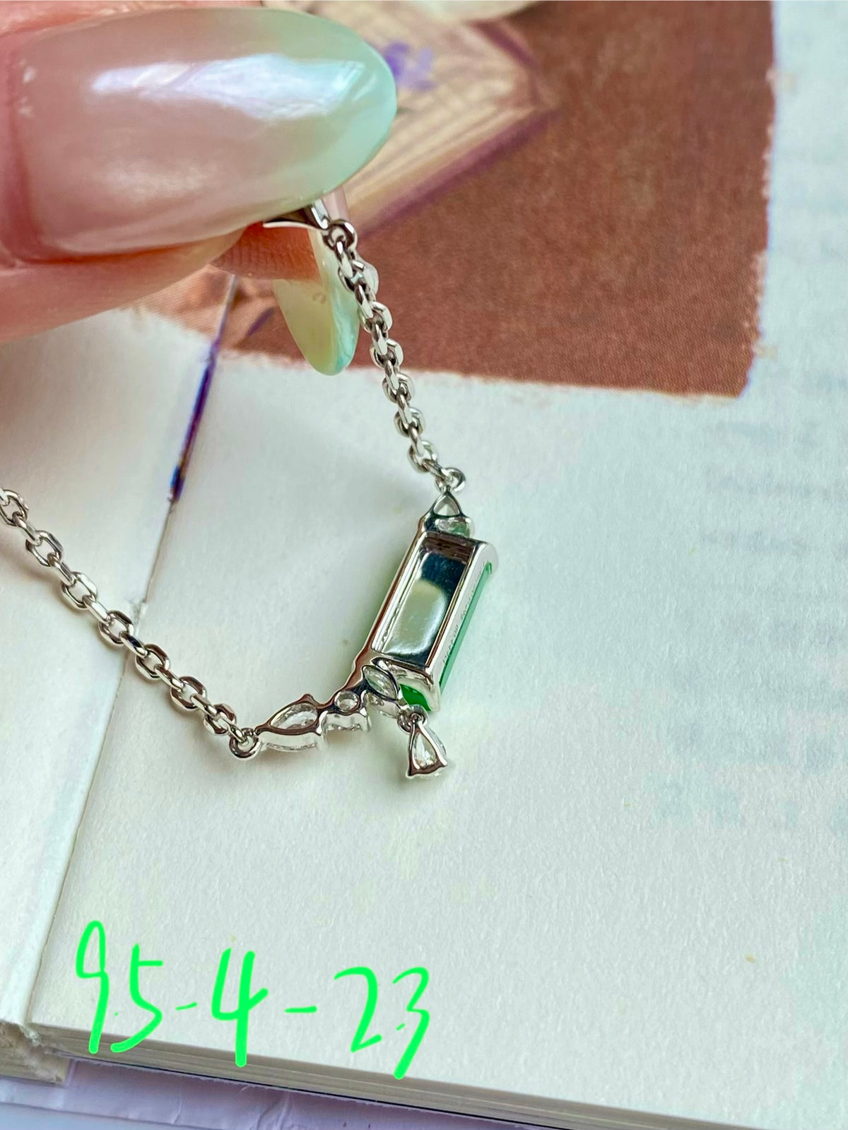 Close-up jadeite tablet bracelet clasp with green and clear stone links