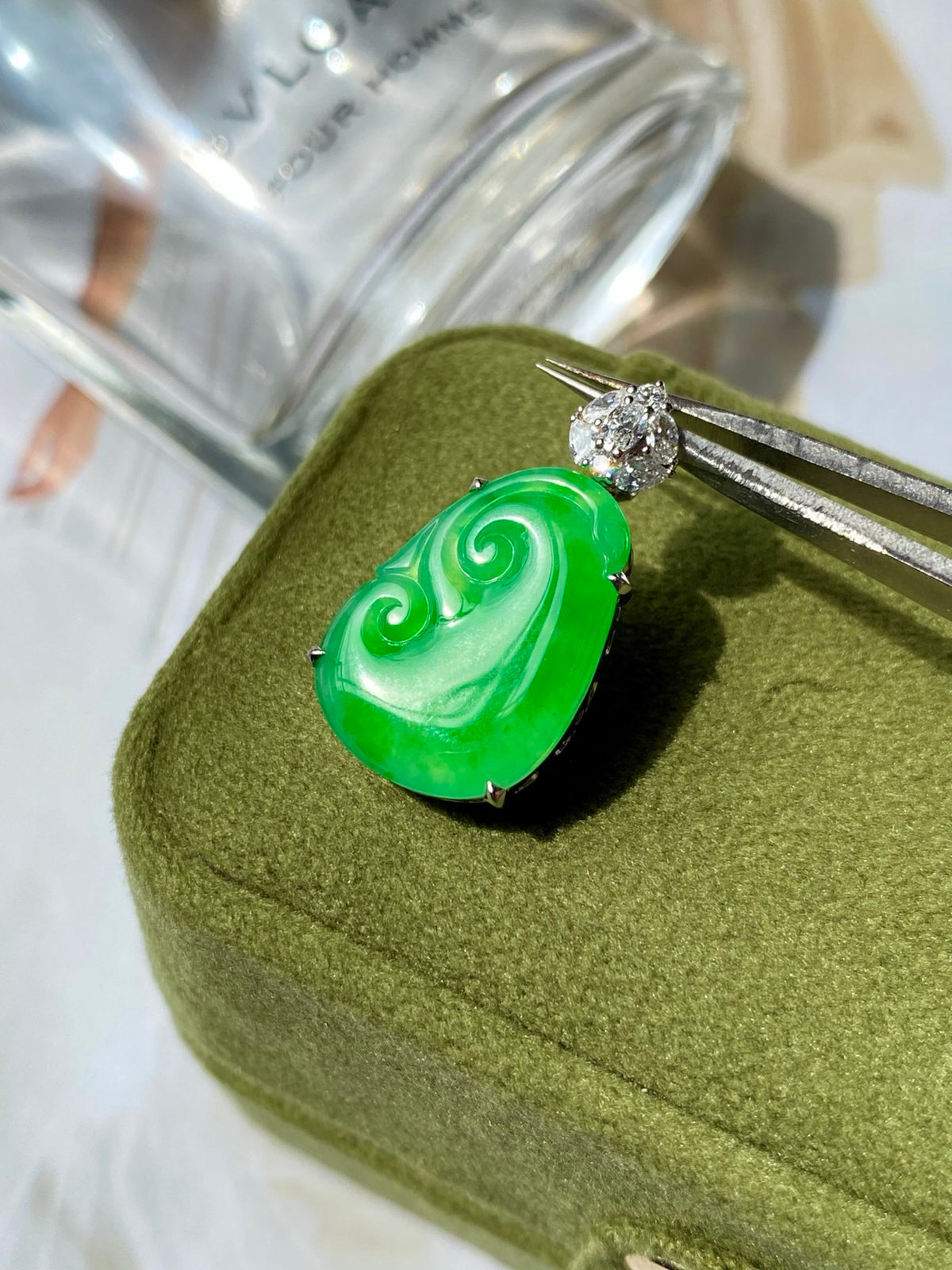 Green jadeite ruyi pendant with small diamond-like stud and silver prong setting