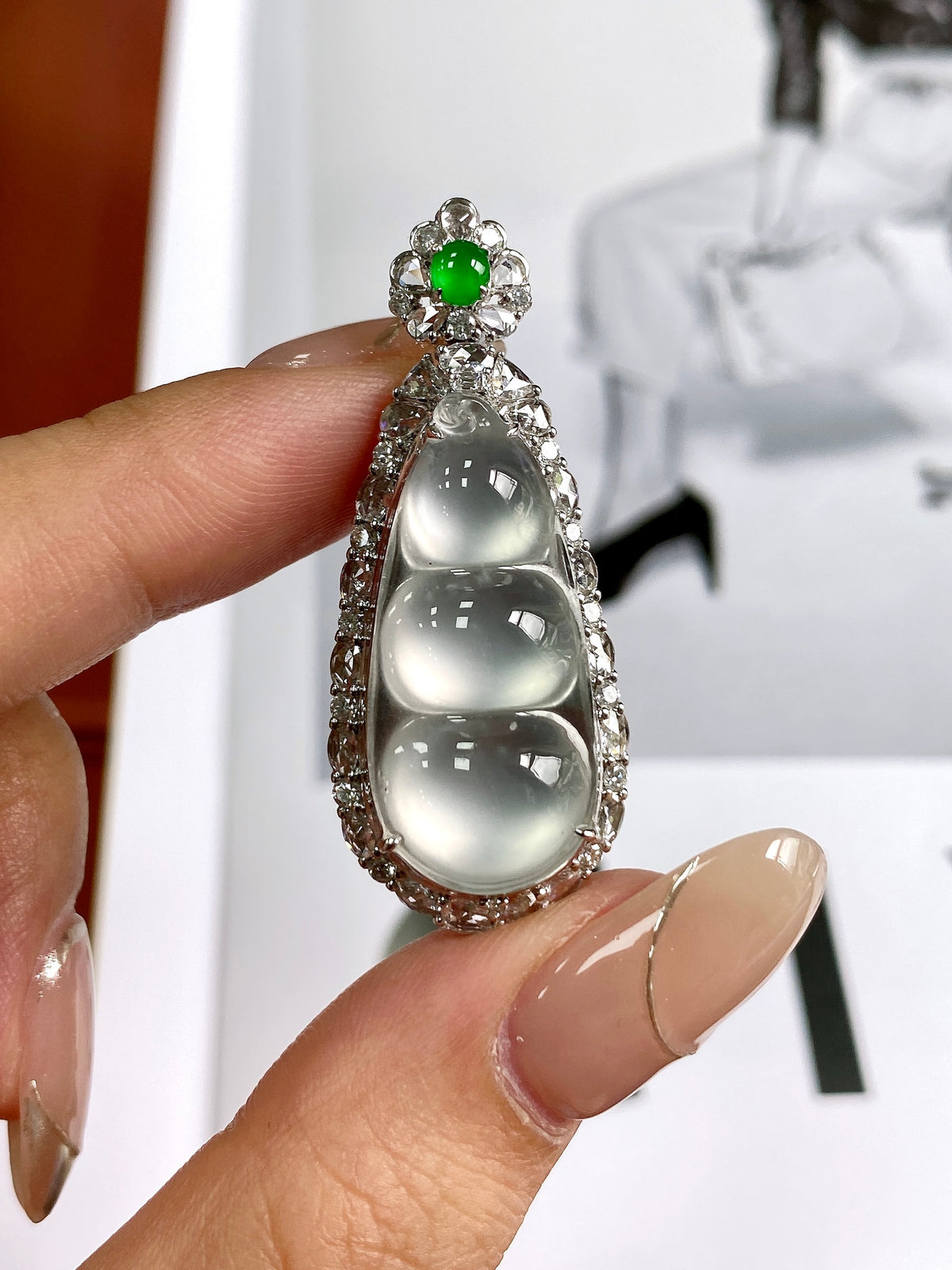 Silver rhinestone bean pendant with green jadeite center and three white teardrop stones