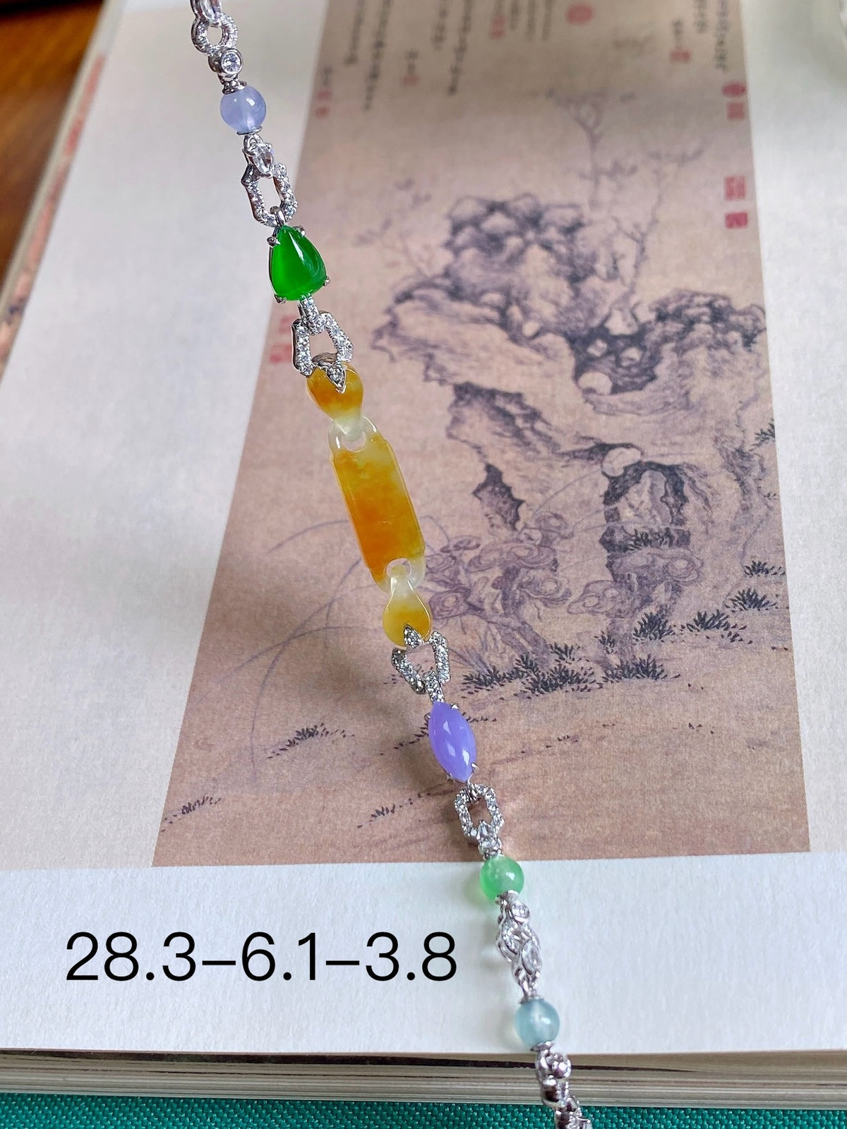 Yellow jadeite bead bracelet with silver links and green, purple, orange stones