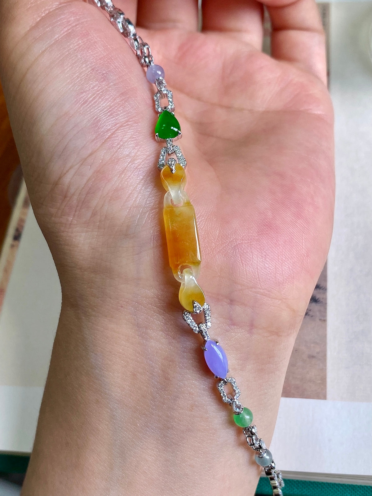 Yellow jadeite bracelet with silver chain, green and purple accents on bead drops