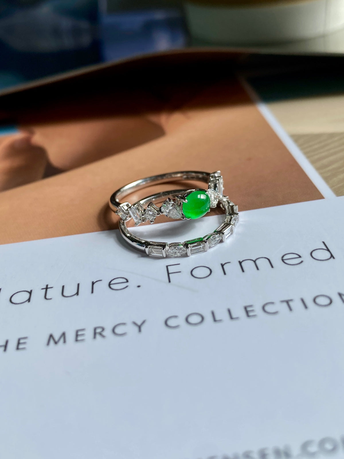 Stackable ring set on card: green jade cabochon with clear stone bands