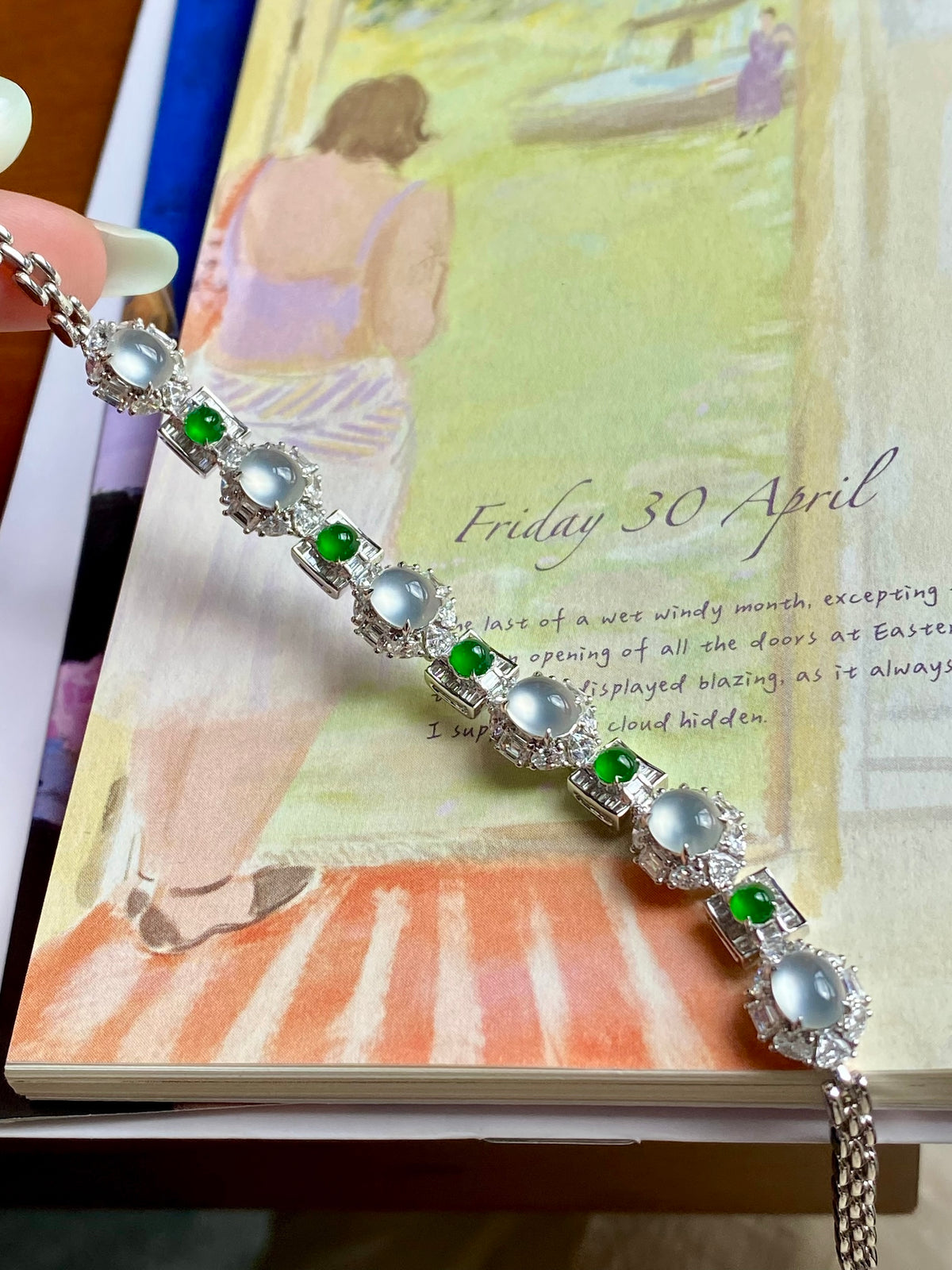 Jadeite cabochon bracelet with oval icy white stones and green gems on link band