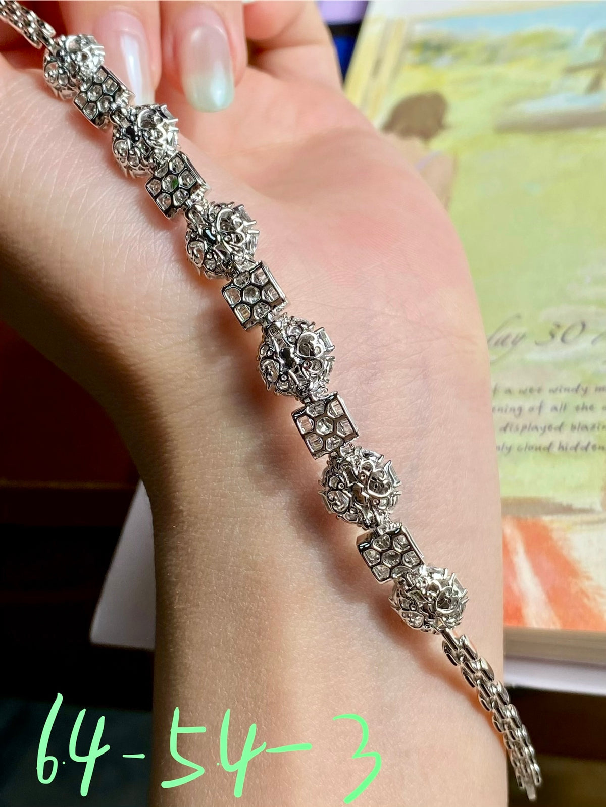 Silver-tone jadeite cabochon bracelet detail with oval cabochons, green stones, clasp