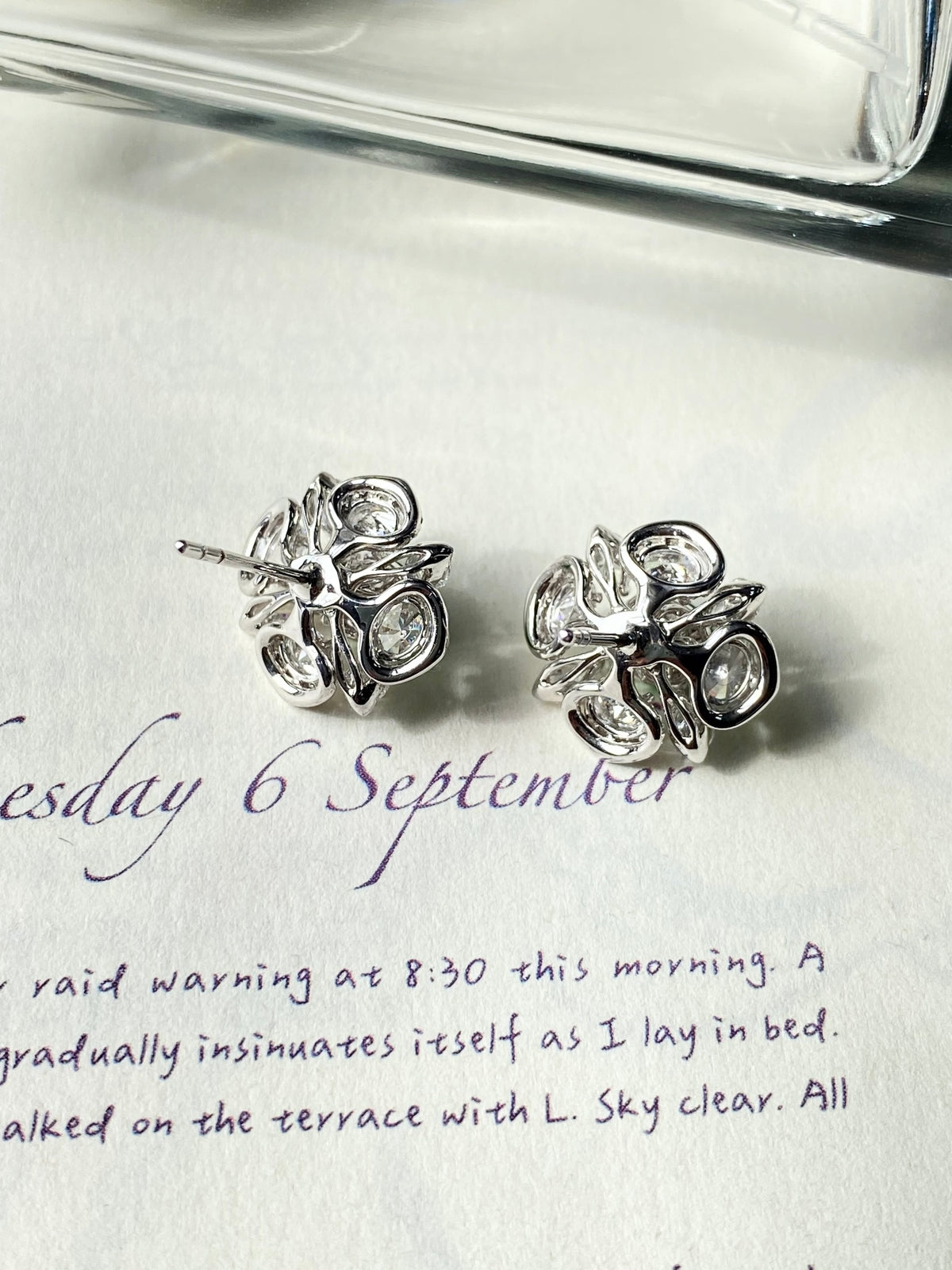 Pair of green jade cabochon stud earrings with clear crystal cluster settings