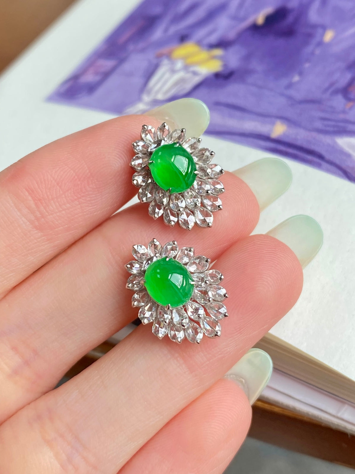 Green jadeite cabochon stud earrings with silver floral halo setting