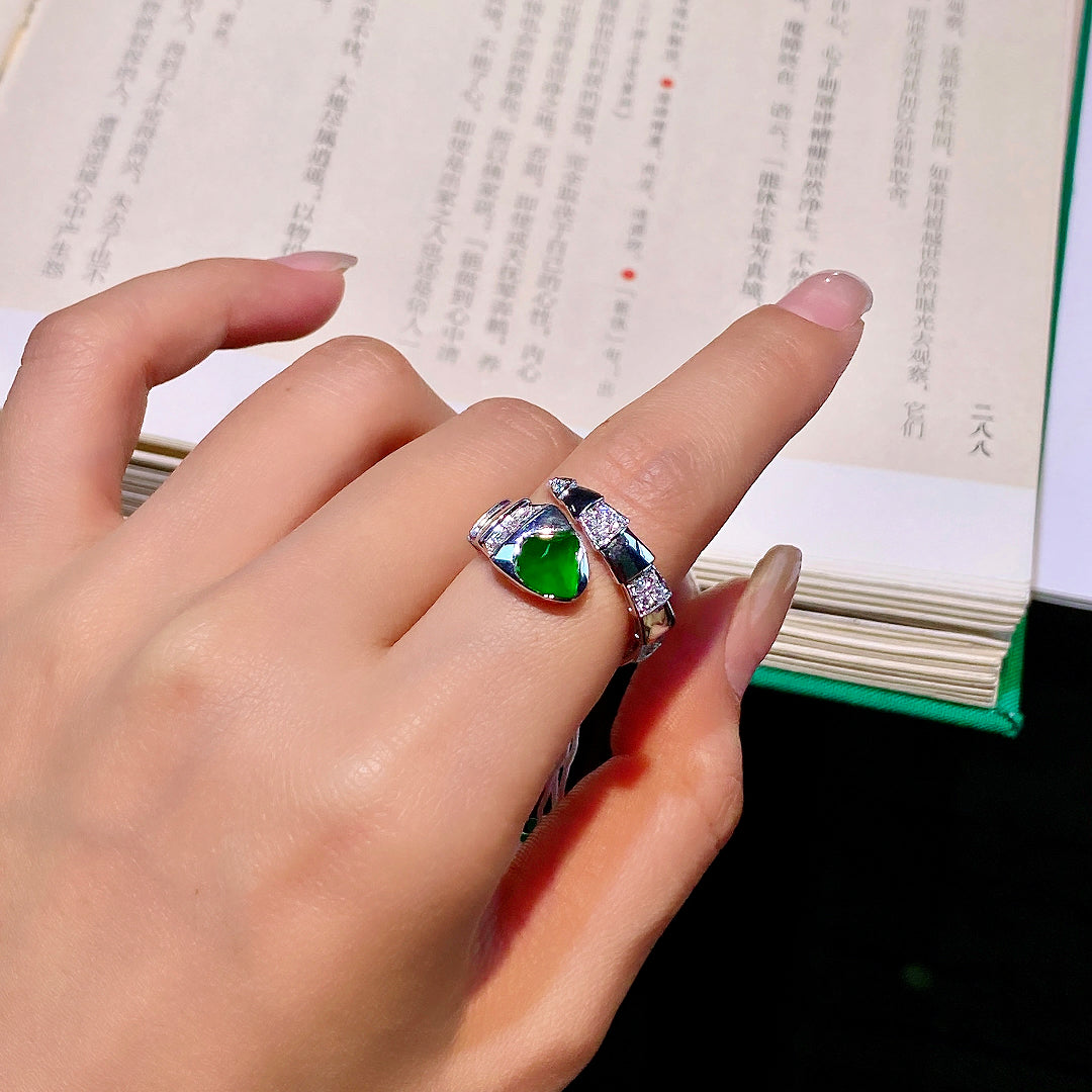 Green jadeite cabochon open ring with silver pavé crystal bands, worn on finger