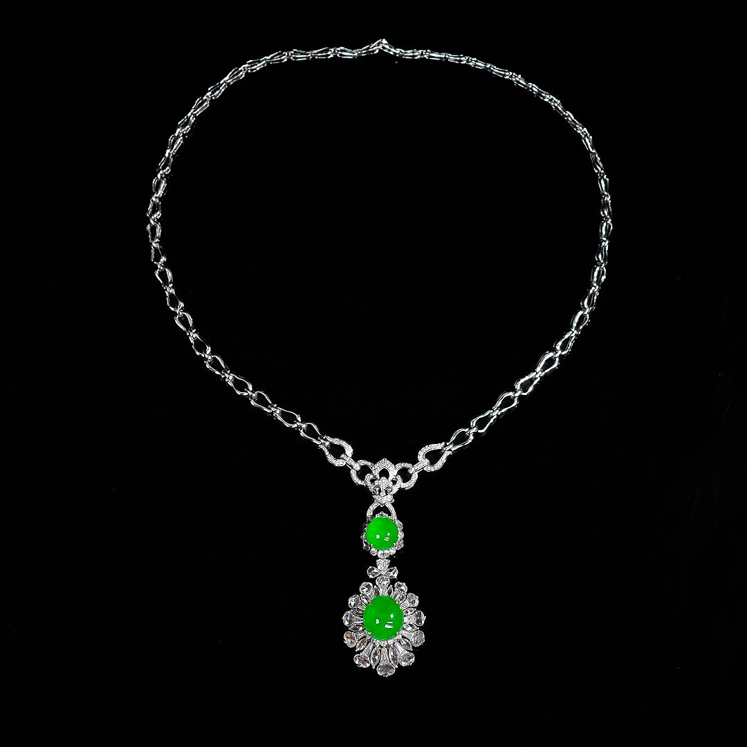 Silver-tone cabochon pendant necklace with two green stones and halo crystal accents