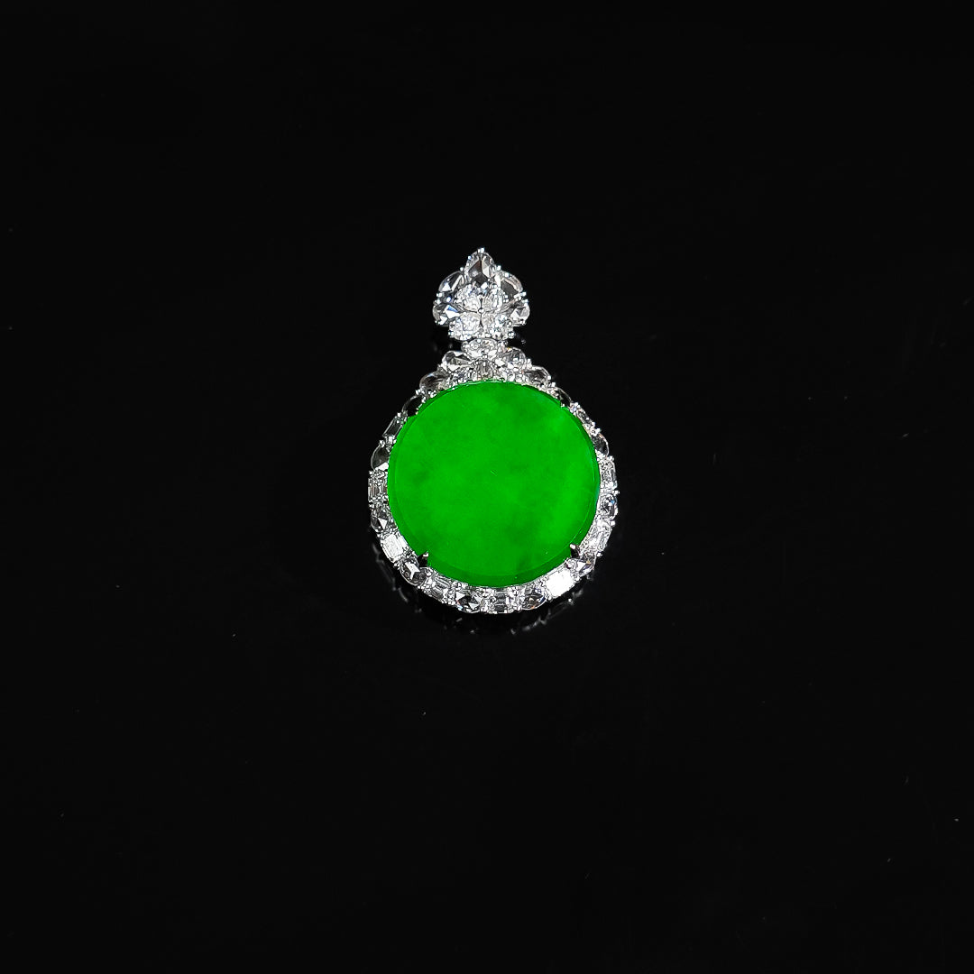 Green jadeite tablet pendant with round green cabochon and clustered clear stone accents
