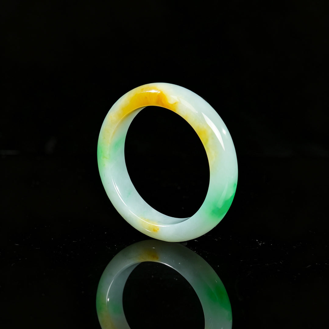 Jadeite bangle with white base, green and yellow highlights, glossy round bracelet