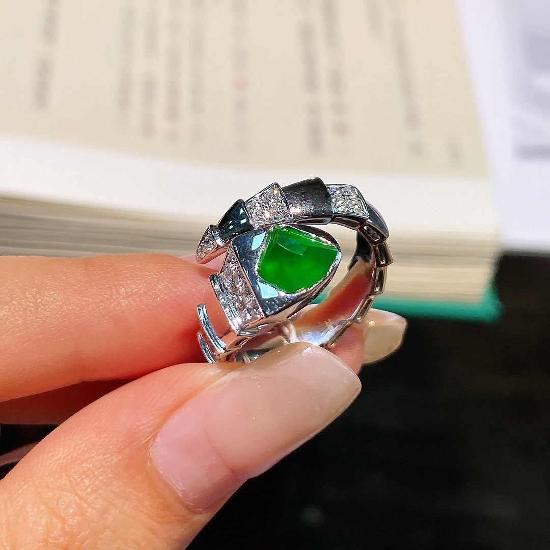 Green teardrop jadeite cabochon open ring with silver pavé borders and split band